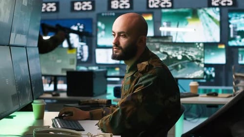 Man Looking at Screens in Military HQ Base Intercepting Ballistic Rockets