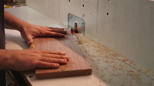 Cabinetmaker in Joinery Using Heavy Machinery Close Up