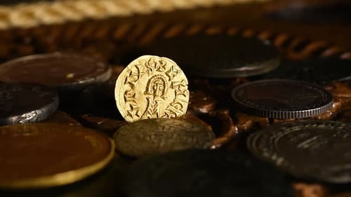 Old Visigothic gold coin in an old rotating wooden chest