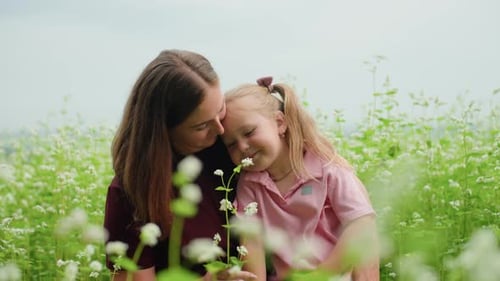 Woman and Girl Share Tender Moment Mother and Young Girl Embrace in Peaceful Meadow Caring Mother