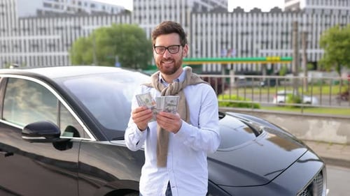 Man with Money By a Car