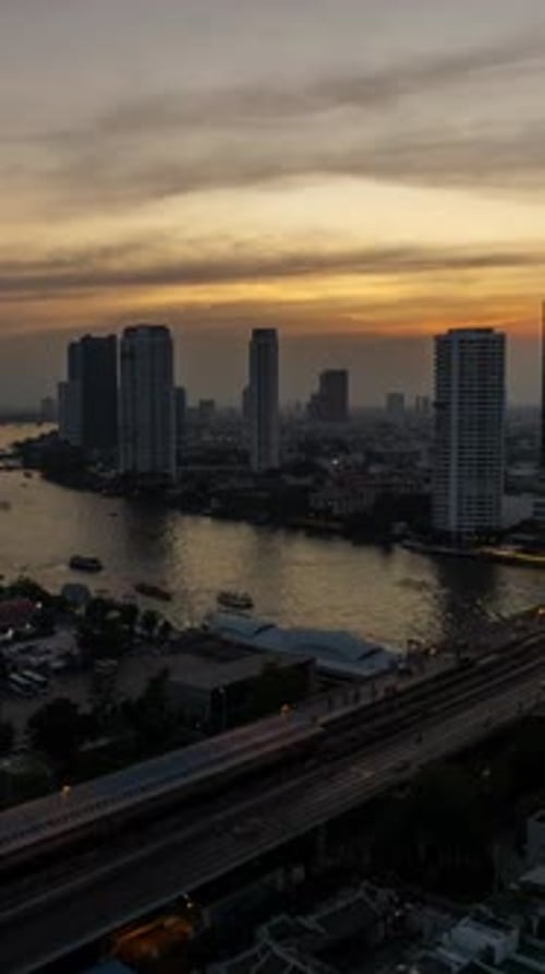 Bangkok city skyline, river and skyscrapers at sunset