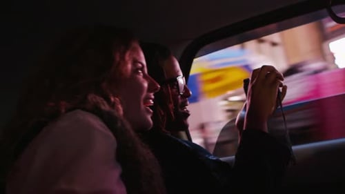 Young Couple Riding in Taxi Cab, New York City 18-19
