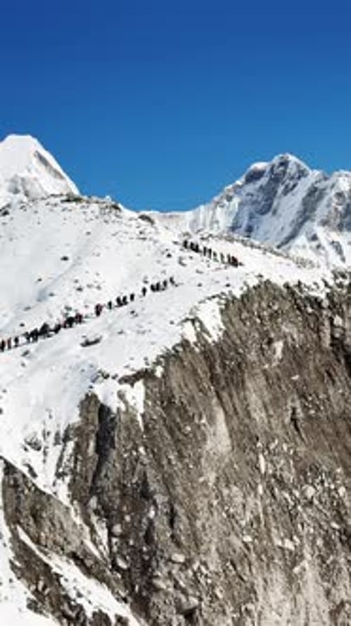 Himalayas Majestic Views of the Snowy Mountains View of Climbers Walking Up Along a Snowy Mountain