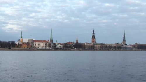 timelapse of Riga old city, cloudy evening turns in to illuminated night