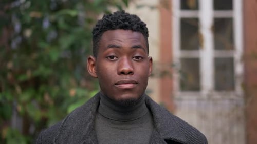 Handsome Young Man with Confident Stare Outside