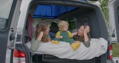 Family Eating in Camper van on Road trip