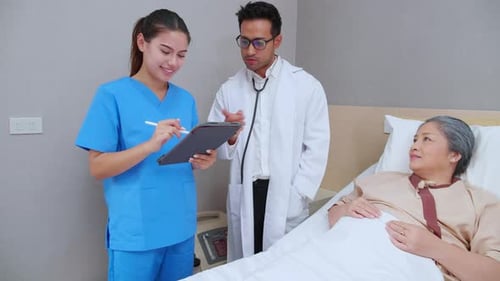 Specialist doctor man and nurse explaining and check with elderly patient in hospital.