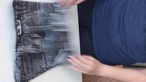 Woman Unpacks Reusable Patterned Bag on Table