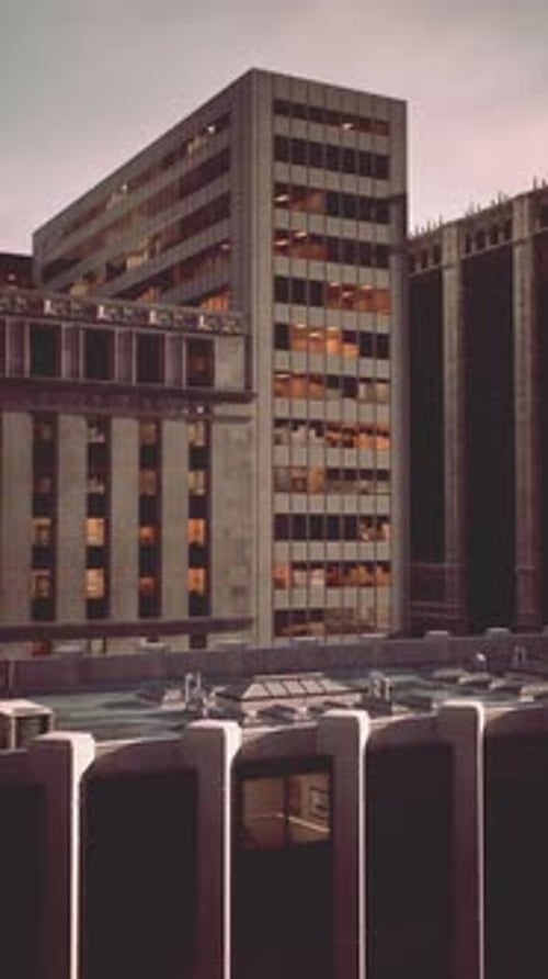 City Buildings Reflect Evening Light While a New Day Approaches