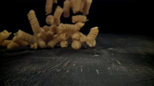 Dry Pasta Falls on the Table Filmed on a Highspeed Camera at 1000 Fps