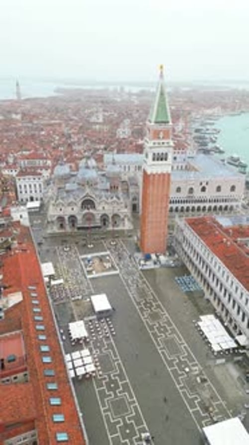 Piazza San Marco St. Mark's Square Basilica Bell Tower in Venice, Italy aerial drone vertical video