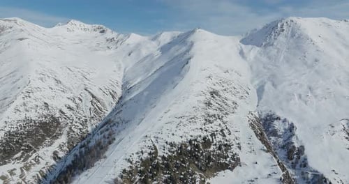 Snowy Mountains and Ski Slopes Aerial View
