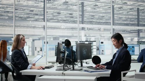 Senior Manager Analyzing Chip Architecture with AI Model in Microchip Factory