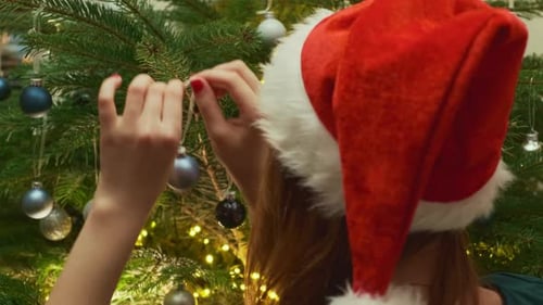 Decorating Christmas Tree with Santa Hat