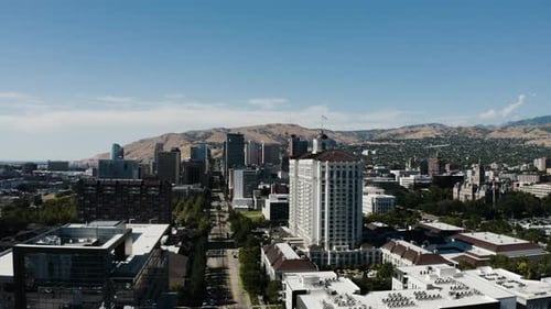 Wide aerial view flying through Salt Lake City's downtown corporate area.