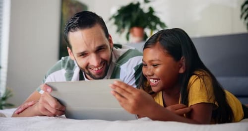 Father and Girl Watching Tablet Together in Bedroom