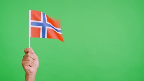 Hand Waving a Flag of Norway on Green Screen