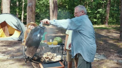Enjoy a Delightful Family Camping Barbecue Experience Set in the Serene Woods Surrounded By Nature