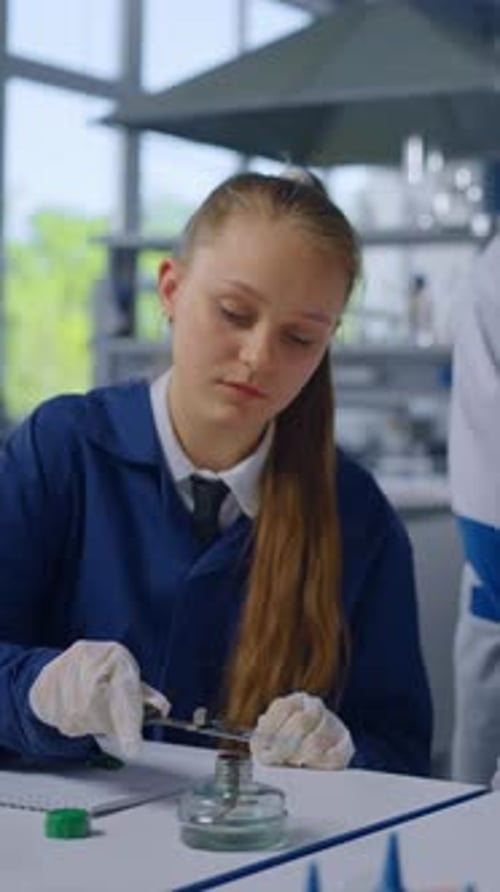 Girl in Lab Coat Working on Science Experiment