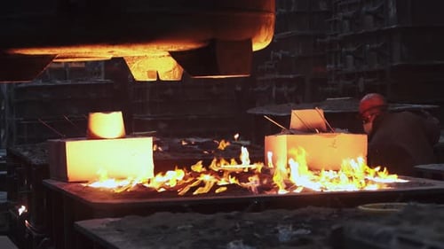 The Intriguing Process of Pouring Molten Metal in a Foundry Environment is Fascinating Stock Clip