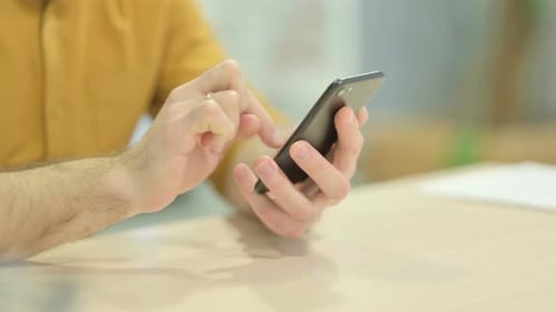 Close up of Male Hand Using Smartphone