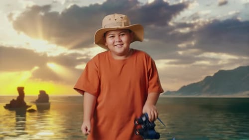 Asian Boy Dancing After Use The Binoculars on Beach