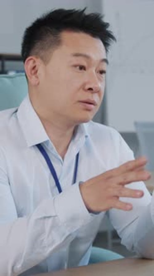 A Focused Business Professional Working on a Computer in a Modern Office Setting