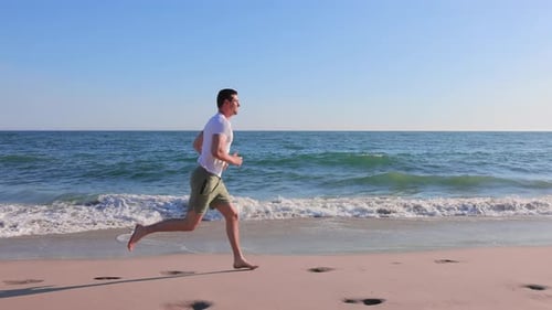 Athletic Man Exercising At The Beach