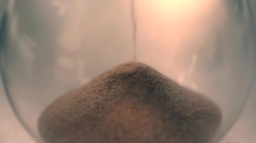 Hourglass with Sand Running Through, Close Up