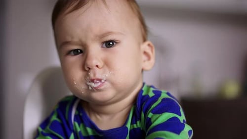 Baby Eating Food with Spoon, Close Up