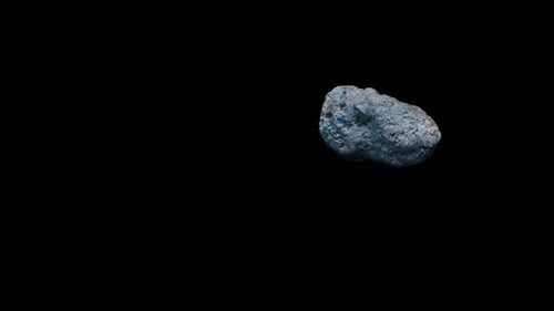 an asteroid flying in space, the video has an alpha channel