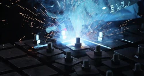 Heavy Industry Worker in Protective Mask Welds Steel and Other Products in a Factory Environment