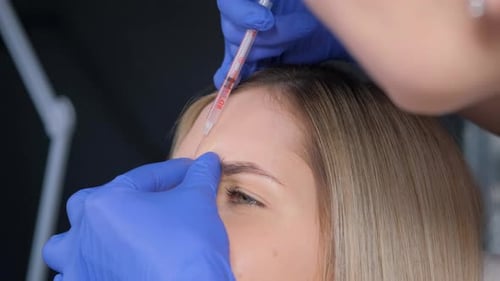 Close up of Woman Receiving Forehead Injections