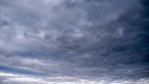 Ominous Clouds Moving Across Gray Sky