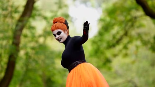 Woman in Costume with Theatrical Makeup in Nature