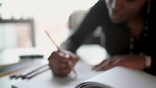 Young Woman Coloring in Coloring Book at Home 2529 Years