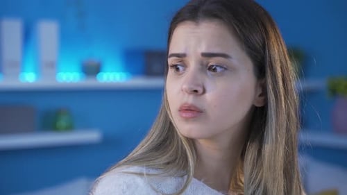 Young woman scared, emotionally and physically battered young woman.