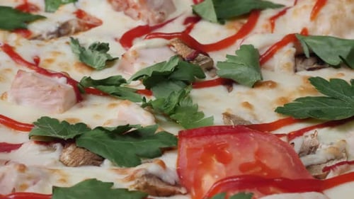 Delicious Pizza Rotating Slowly Showing Its Ingredients