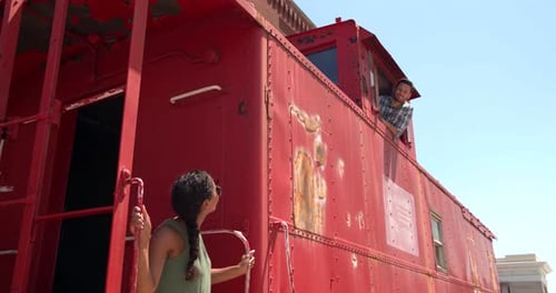 Couple exploring historical vintage trains at wichita Kansas transportation museum