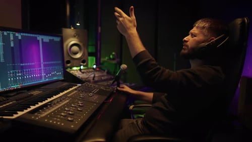 Music Production Sound Engineer Working with Recording Equipment in Studio Professional