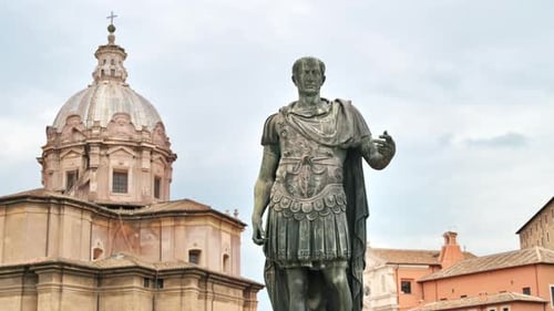 Statue of Julius Caesaer located in the centre of Rome, Italy. Buildings on the background
