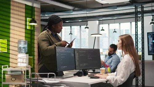 Friendly Coworkers Helping Junior Dev Code AI Algorithms to Debug Software