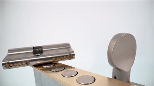 Metal door lock cylinder close up isolated 4K
