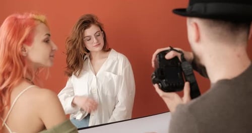 Female Model on the Photo Shoot in the Studio with Male Photographer and Assistant