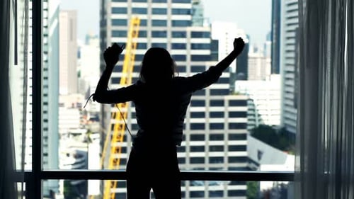 Woman Dancing, Listening to Music in City Apartment