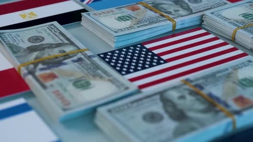 Flags and Bundles of US Hundred Dollar Bills