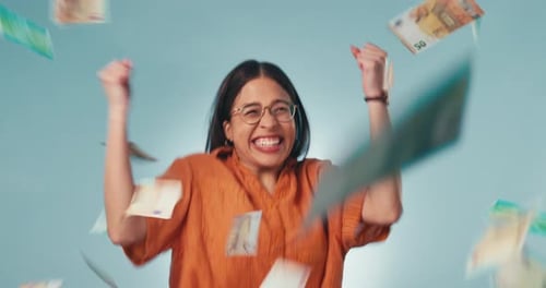 Woman Celebrates Tossing Money in the Air