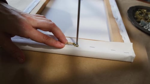 Attaching Hanger to Wood Canvas Frame with Screwdriver