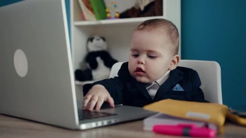 Cute Baby in Suit Using Laptop Computer